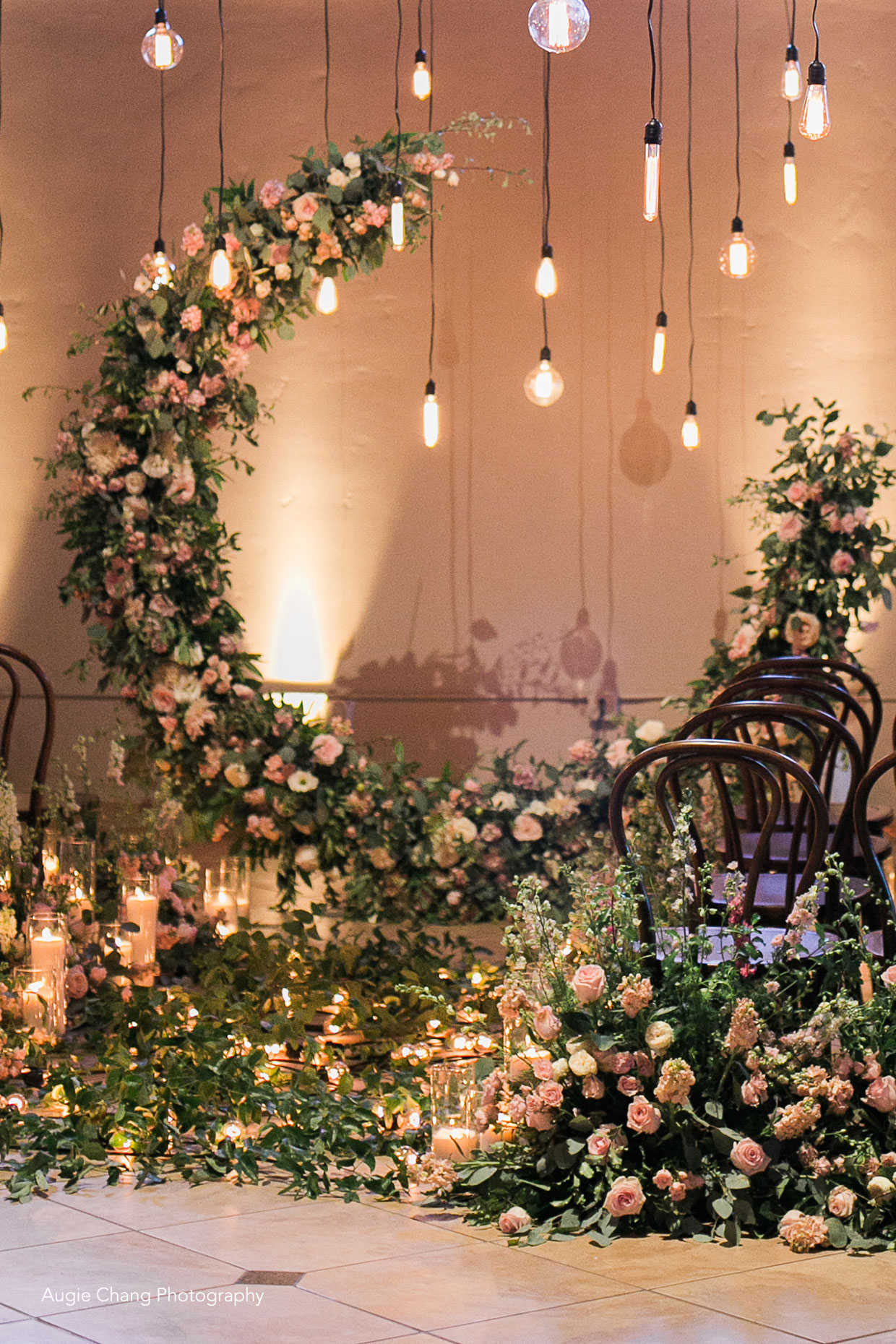 Over-the-top, romantic ceremony floral crescent arch at Casa Real at Ruby Hill Winery (www.casarealevents.com).  Photo by: Augie Chang Photography; Florals and Design: Nicole Ha Design; Ceremony Chairs: Pleasanton Rentals; Lighting: Fantasy Sound Event Services